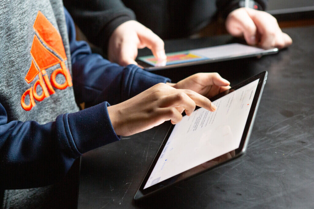 Students working on tablets in a classroom